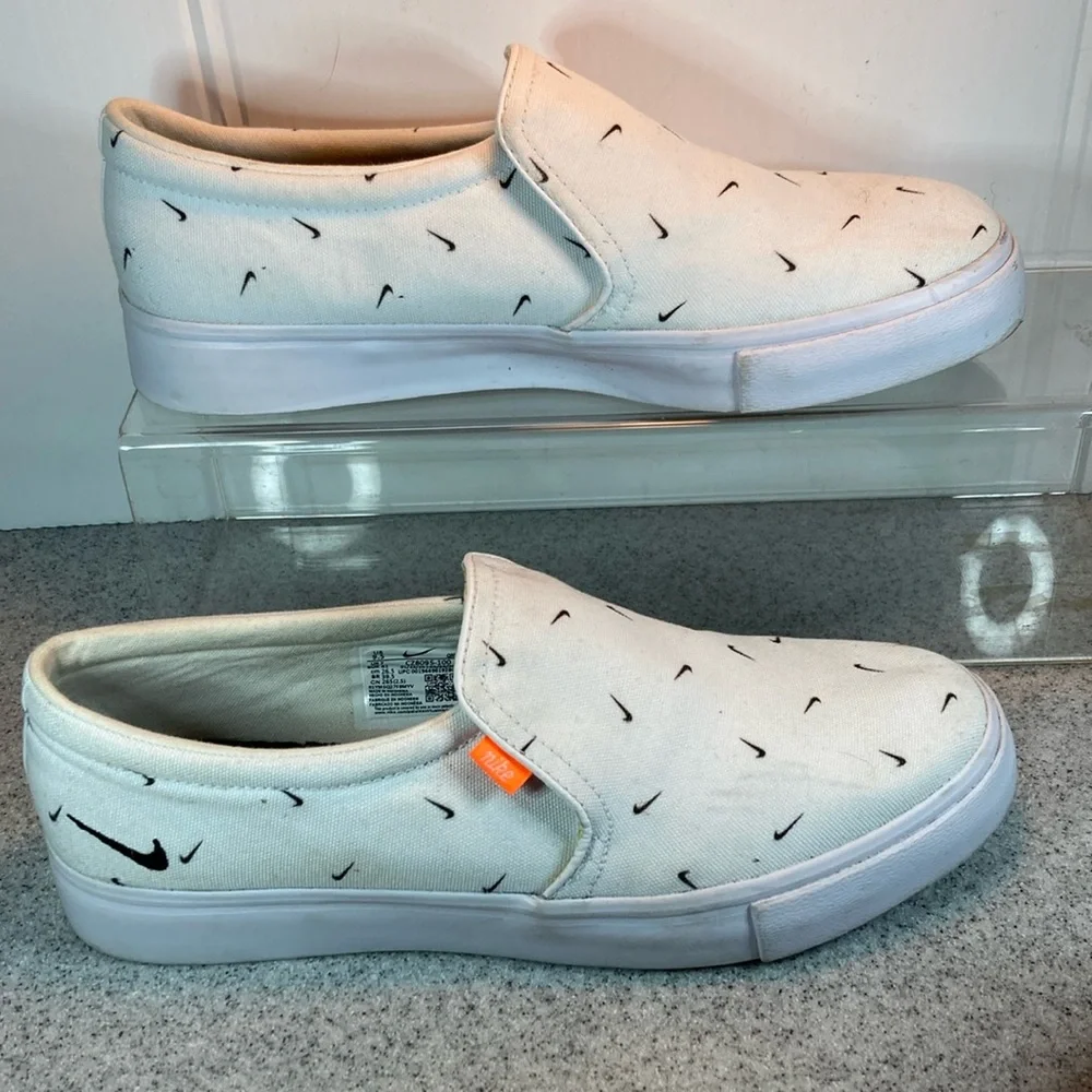 Size 9.5 Nike white slip on surfer skater‎ style with swooshes all over. 5